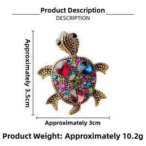 Detailed view of turtle brooch with colorful crystals and antique gold finish