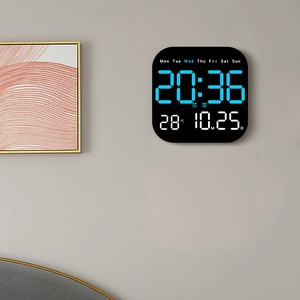Modern black LED wall clock with blue digital display showing time date and temperature