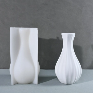 Detailed view of striped silicone vase mold and the finished modern gypsum vase product