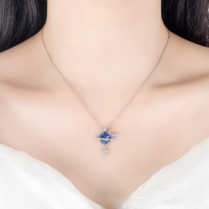 Zircon moon and star planet necklace in silver finish worn on model neck