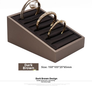 Dark brown microfiber jewelry display stand with multi-slot design for rings and bracelets