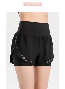 Detail of high-waist double-layer sports shorts with breathable fabric and printed logo