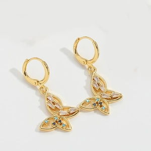 Detail of golden butterfly drop earrings with blue and white zircon micro-inlays