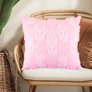 Detailed view of a pink plush pillowcase featuring 3D tulip patterns on a rattan chair