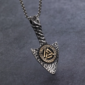 Viking arrow necklace with silver Valknut pendant and gold runic details on rock