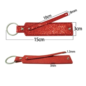 Detail view of a 15cm red glitter keychain with dimensions for DIY strap attachment