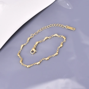 Minimalist 18K gold plated bean link bracelet with polished geometric charms and lobster clasp