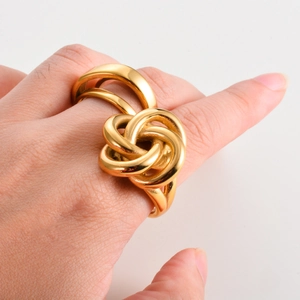 Modern gold-tone stainless steel knot ring featuring a bold twisted multi-layer design