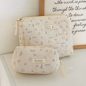 Quilted makeup bag set with cute bear and bow patterns for versatile travel storage