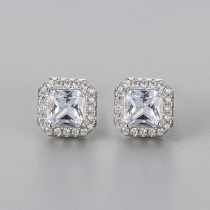 Detailed macro view of square cluster stud earrings with silver plating and zircon stones