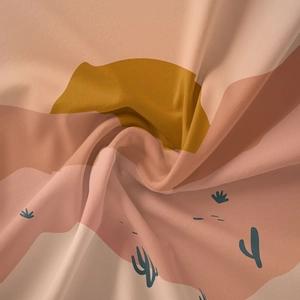 Close-up of bohemian desert tapestry fabric showing woven texture and mountain pattern