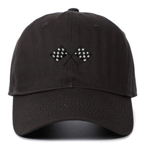 Close-up of racing flag embroidery on black cotton twill baseball cap with curved brim