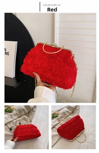 Detail of red rose evening clutch bag featuring gold chain and rhinestone clasp
