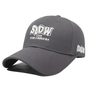 Dark gray baseball cap with white embroidered Slow Life text in a premium cotton finish