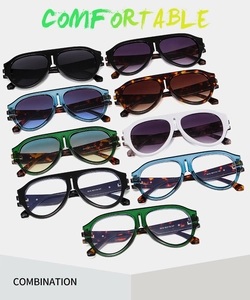 Flat lay of vintage oversized aviator sunglasses in various colors and textures