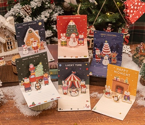 Close-up of 3D pop-up Christmas greeting cards with festive holiday illustrations