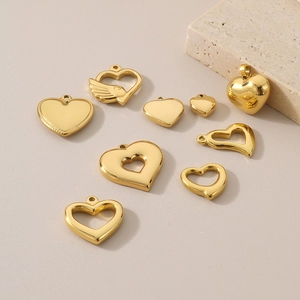 Collection of golden heart-shaped stainless steel charms in various sizes and designs
