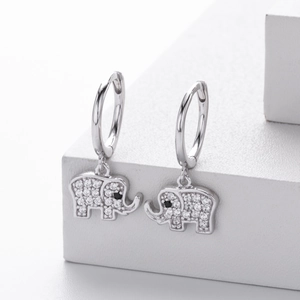 Detailed macro shot of S925 silver elephant earrings with sparkling cubic zirconia inlay