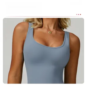 Detail of grey-blue high-waisted yoga bodysuit featuring a deep U-neckline design