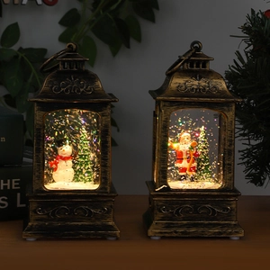 Vintage bronze Christmas lantern with snowmen and warm lighting for festive table decoration