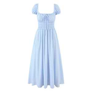 Detail view of the smocked elastic bodice and tie knot on light blue striped puff sleeve dress