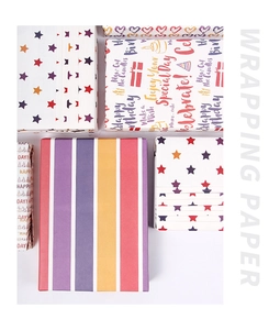 Variety of colorful striped and star pattern gift wrapping paper rolls for birthdays