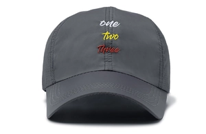 Detailed embroidery on a dark grey breathable mesh baseball cap for outdoor sports