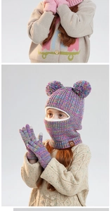 Detail of colorful rainbow knit kids winter balaclava with pompoms and touch gloves