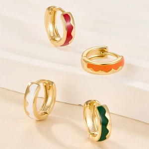 925 silver colorful enamel hoop earrings with wavy gold-plated design on white pedestal