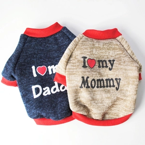 Detail of fleece dog sweaters with I Love Mommy Daddy prints and red ribbed cuffs