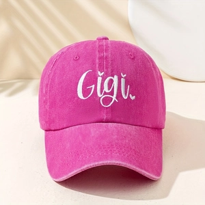 Detail of the Gigi white embroidery on a washed rose pink cotton baseball cap fabric