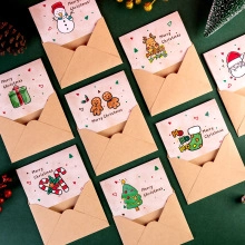Detailed view of mini Christmas cards with diverse hand-drawn festive patterns and kraft envelopes