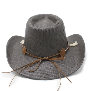Detail of dark grey woven cowboy hat featuring colorful bands and suede accents