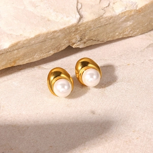 Close-up of 18K gold plated teardrop stud earrings with elegant white pearls