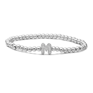 Detailed view of silver beaded bracelet featuring a micro-pave zircon M letter charm
