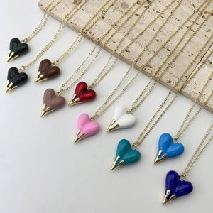 Elegant heart pendant necklaces in multiple colors with golden chain and enamel finish