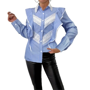Detail of blue and white striped shirt featuring white lace ruffle and collar design