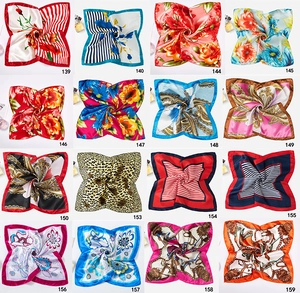 Grid display of 16 different leopard and floral print satin scarves with silk texture