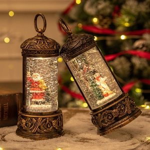 Vintage bronze Christmas lantern with Santa and snowman scenes and glowing glitter