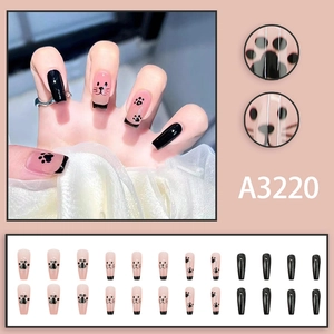 Cute pink and black French press-on nails with cartoon cat paw prints and kitten patterns