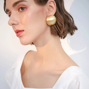 French style exaggerated golden ball drop earrings for women with elegant metallic finish