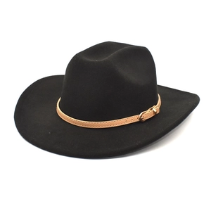 Detail of black wool fedora hat featuring a light brown leather band with gold buckle