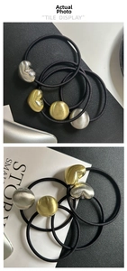 Close-up of high-elasticity hair ties featuring brushed metal heart and round beads