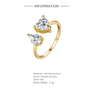 Macro detail of gold plated S925 sterling silver ring with heart and teardrop zirconia