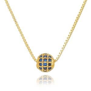 Detailed view of golden sphere pendant with blue stones on a box chain necklace