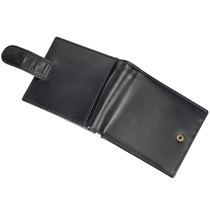 Close-up of black genuine leather wallet showing fine texture and snap button closure