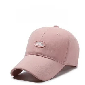 Detail of pink cotton baseball cap with oval Preste embroidery and breathable eyelets