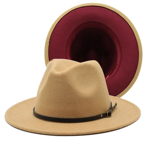 Detail of camel wool fedora with burgundy interior and black leather belt buckle strap