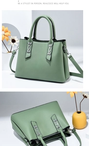 Detail of mint green matte leather handbag with silver chain hardware and strap