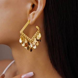 Detail of 18K gold plated square hoop earrings with metal water drop tassels on model